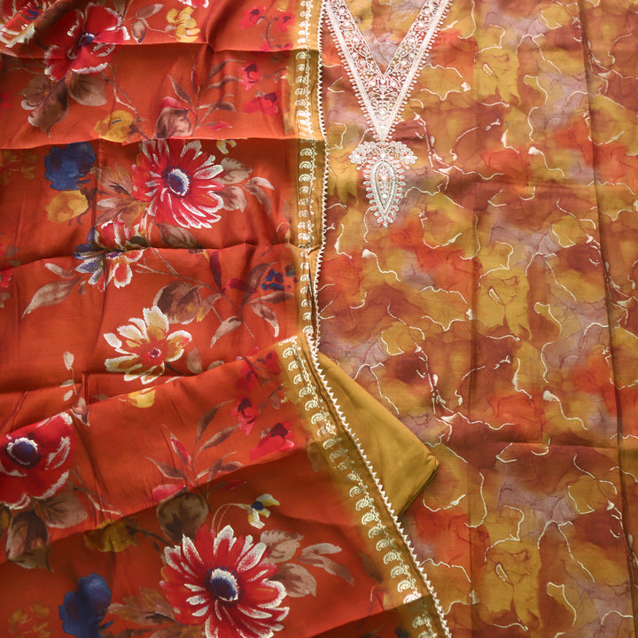 Adaakari Dark Mustard Orange Zari Embellish Neck Work Floral Print Muslin Suit Set