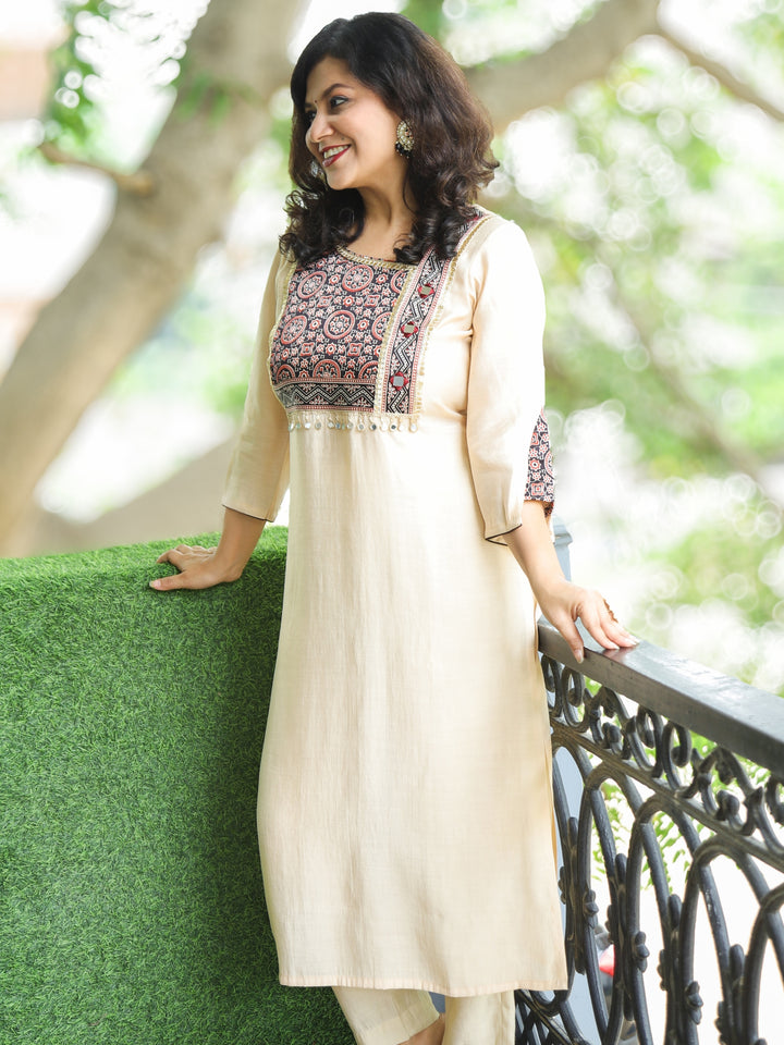 Nirvi Shell Beige Mashru Patch Work Neck with Mirror Work Roman Silk Kurti