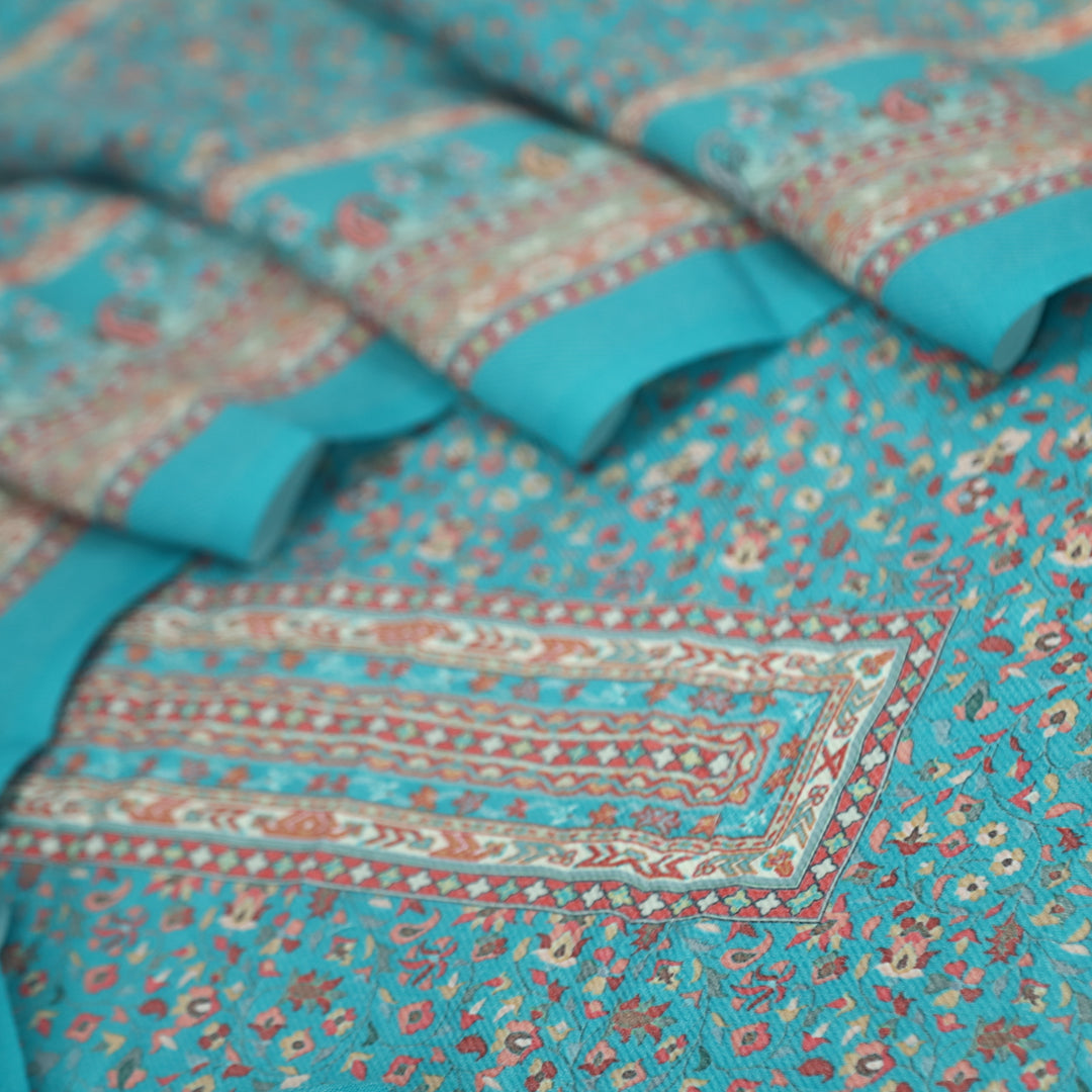 Ruhaan Aqua Blue Floral Kanni Printed Semi Pashmina Suit Set