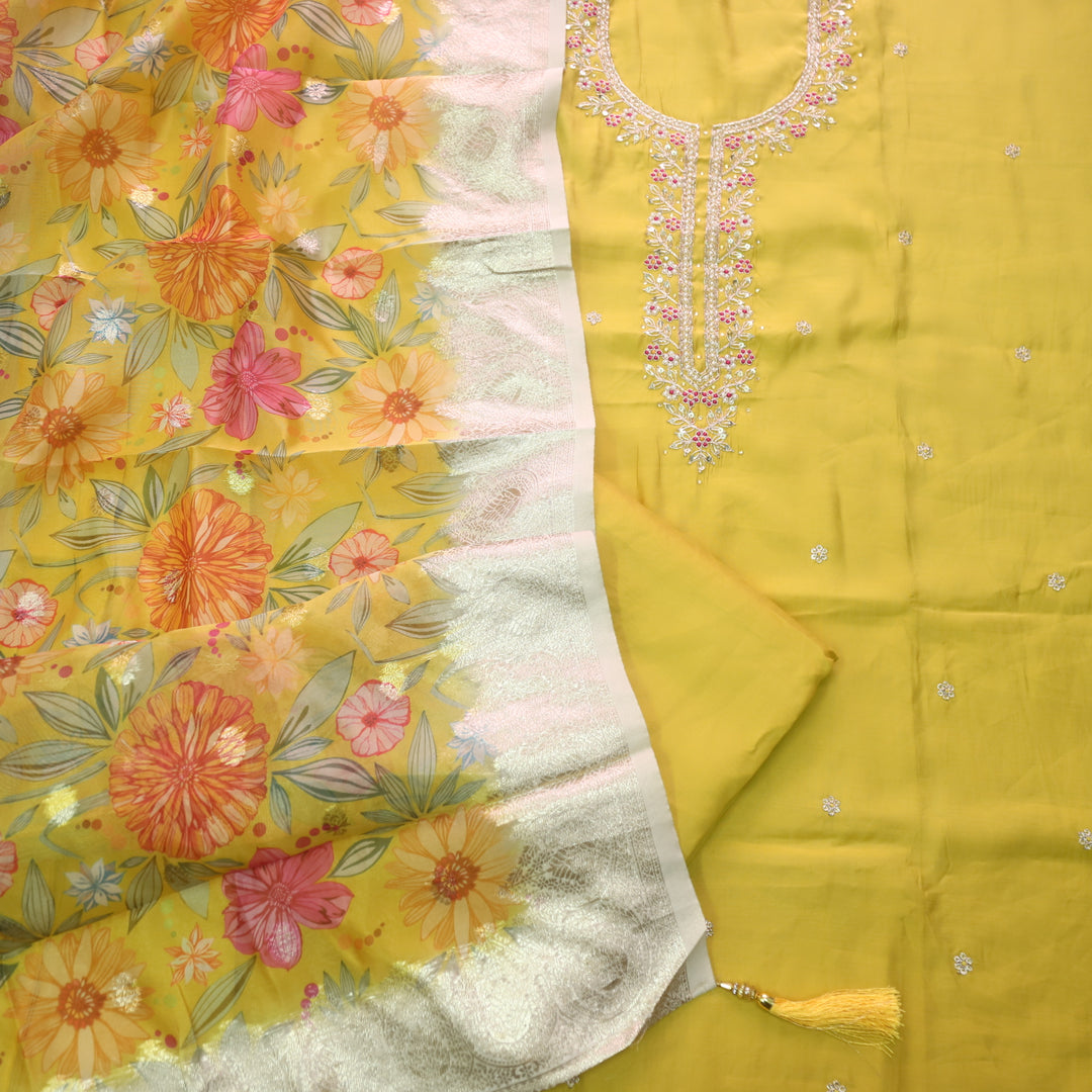 Ishaani Turmeric Yellow Embellished Neck with Moti Work Modal Suit Set