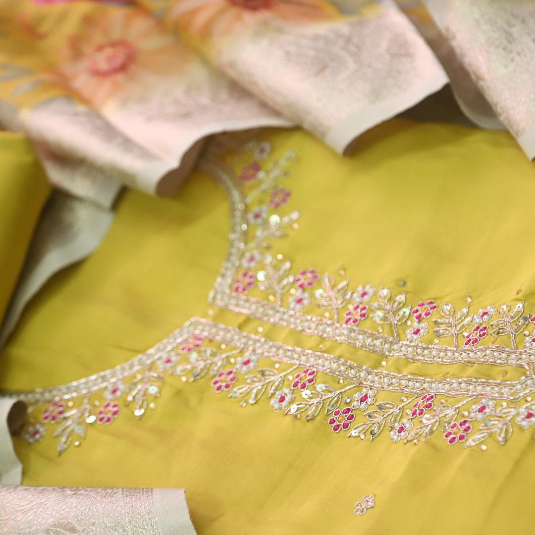 Ishaani Turmeric Yellow Embellished Neck with Moti Work Modal Suit Set