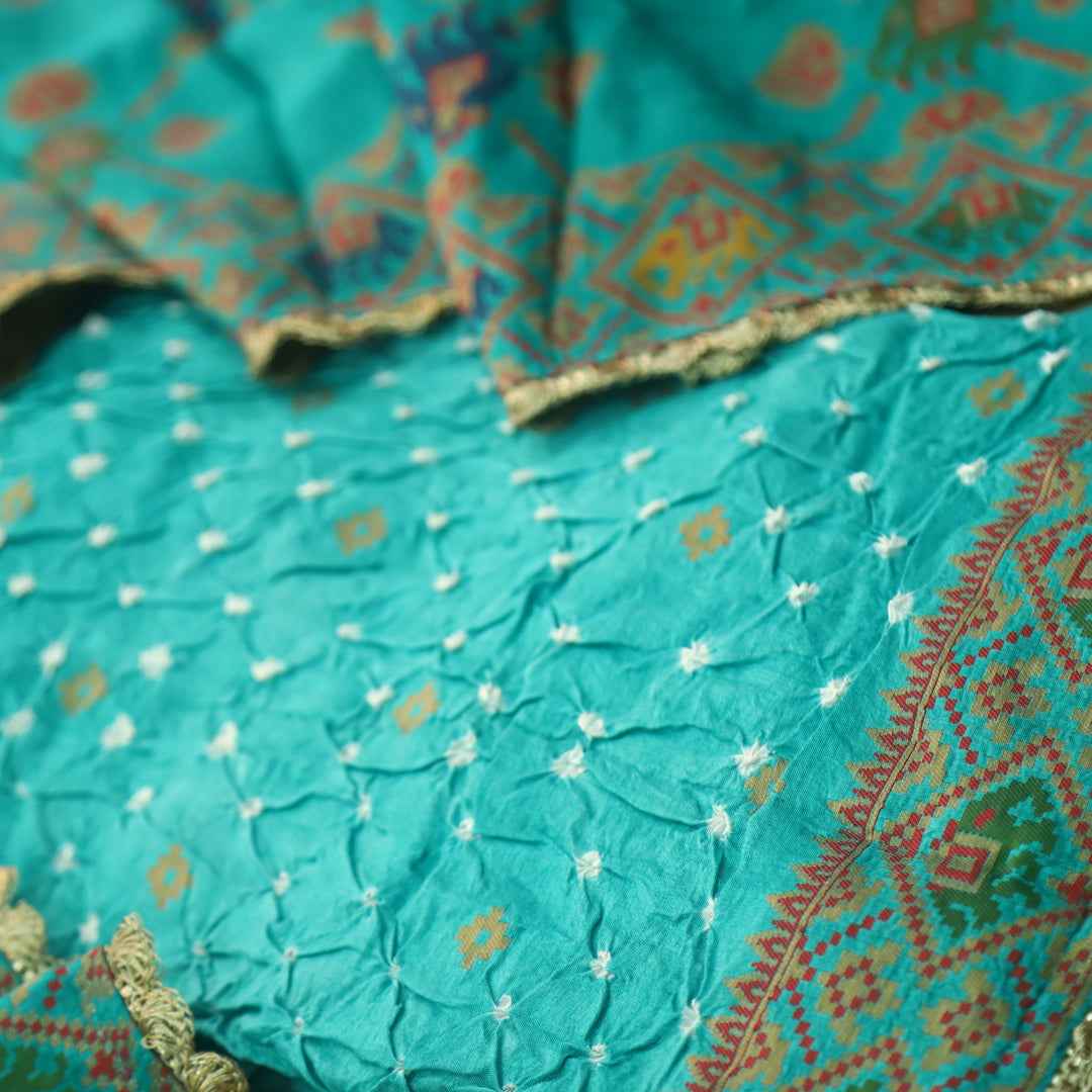 Naari Aqua Teal Thread Weaved with All Over Bandhej Work Crepe Silk Suit