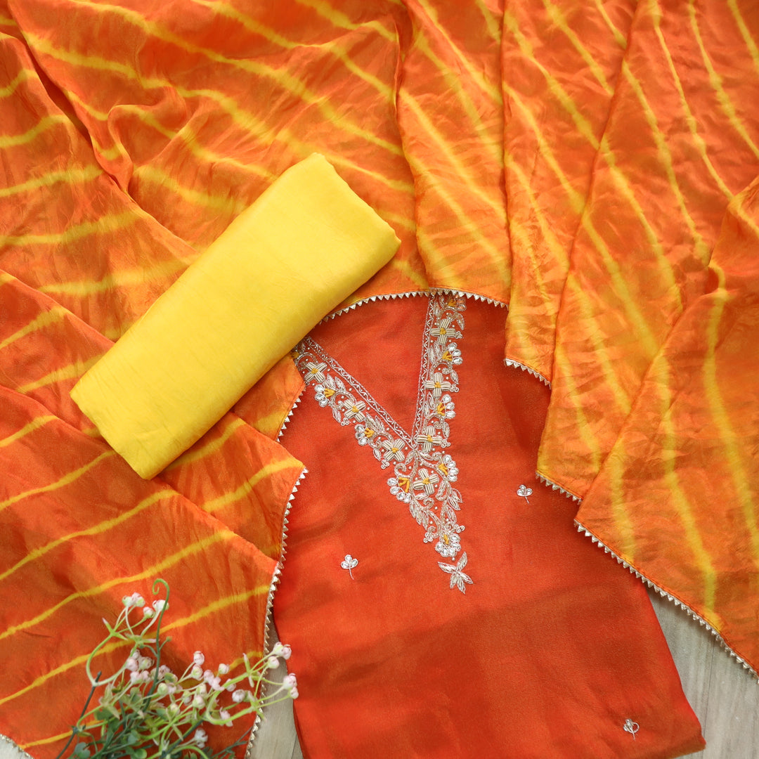 Falak Inter.Orange Embellished Neck Work in Shimmer Tissue Silk Suit Set