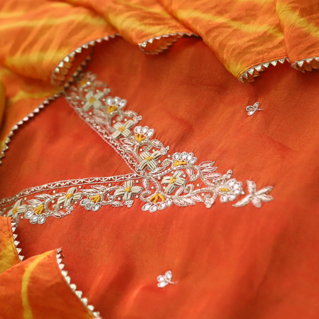 Falak Inter.Orange Embellished Neck Work in Shimmer Tissue Silk Suit Set