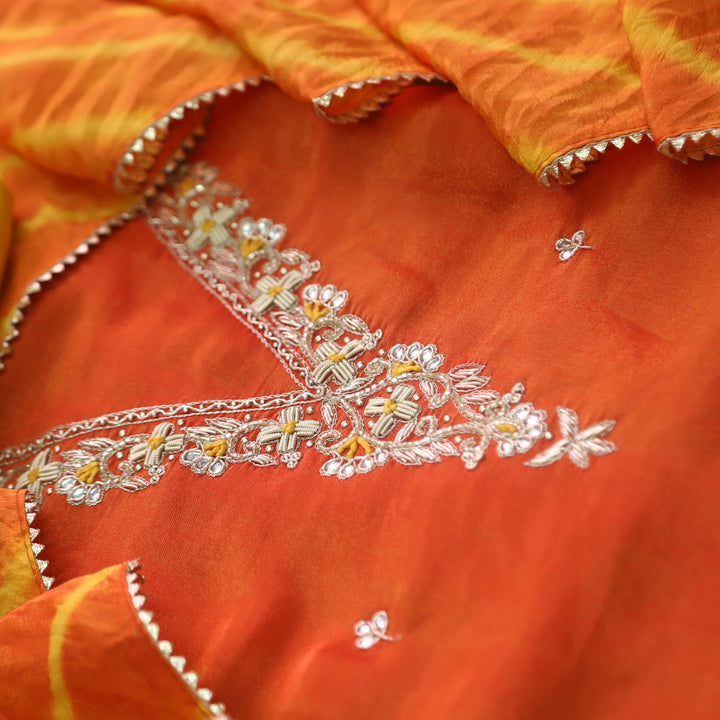 Falak Inter.Orange Embellished Neck Work in Shimmer Tissue Silk Suit Set