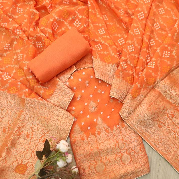 Naari Vivid Orange Zari Weaved with All Over Bandhej Work Crepe Silk Suit