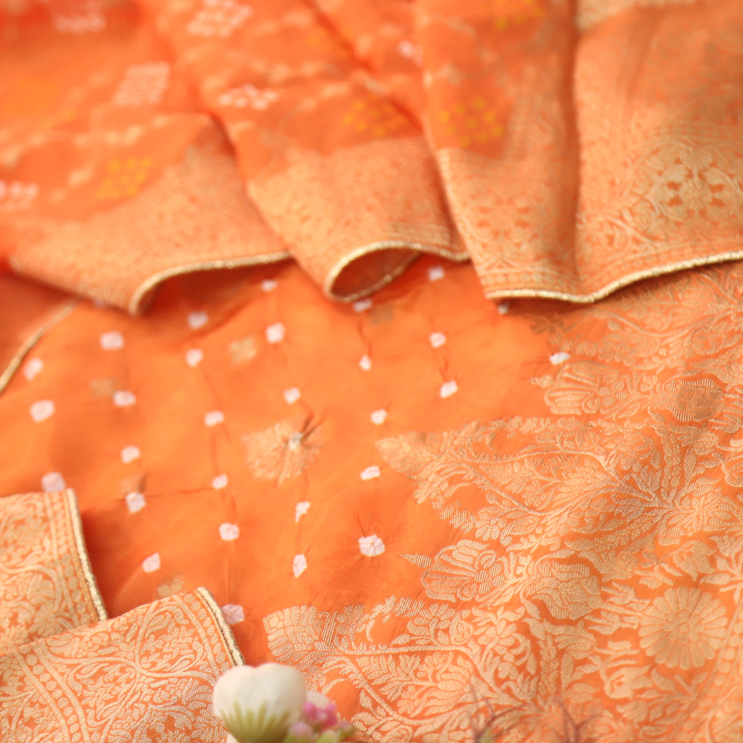 Naari Vivid Orange Zari Weaved with All Over Bandhej Work Crepe Silk Suit