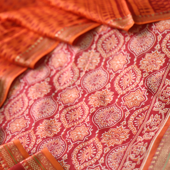 Zinat Coral Orange Ajrak Printed in Mangalgiri Hem Work Cotton Suit Set D1