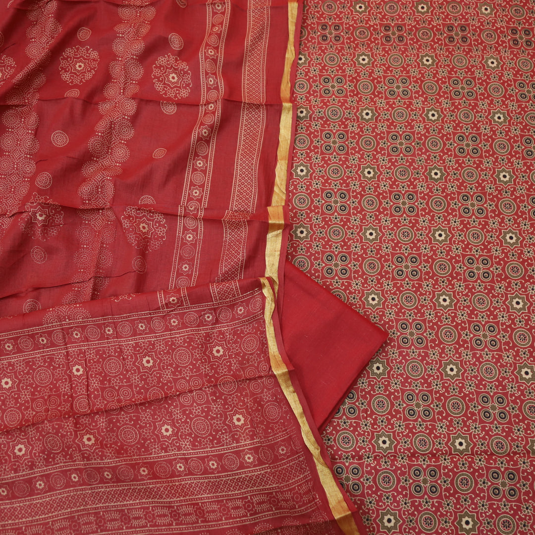 Kranti Berry Red Ajrak Printed Lagdi Patta Hem Work Cotton Suit Set