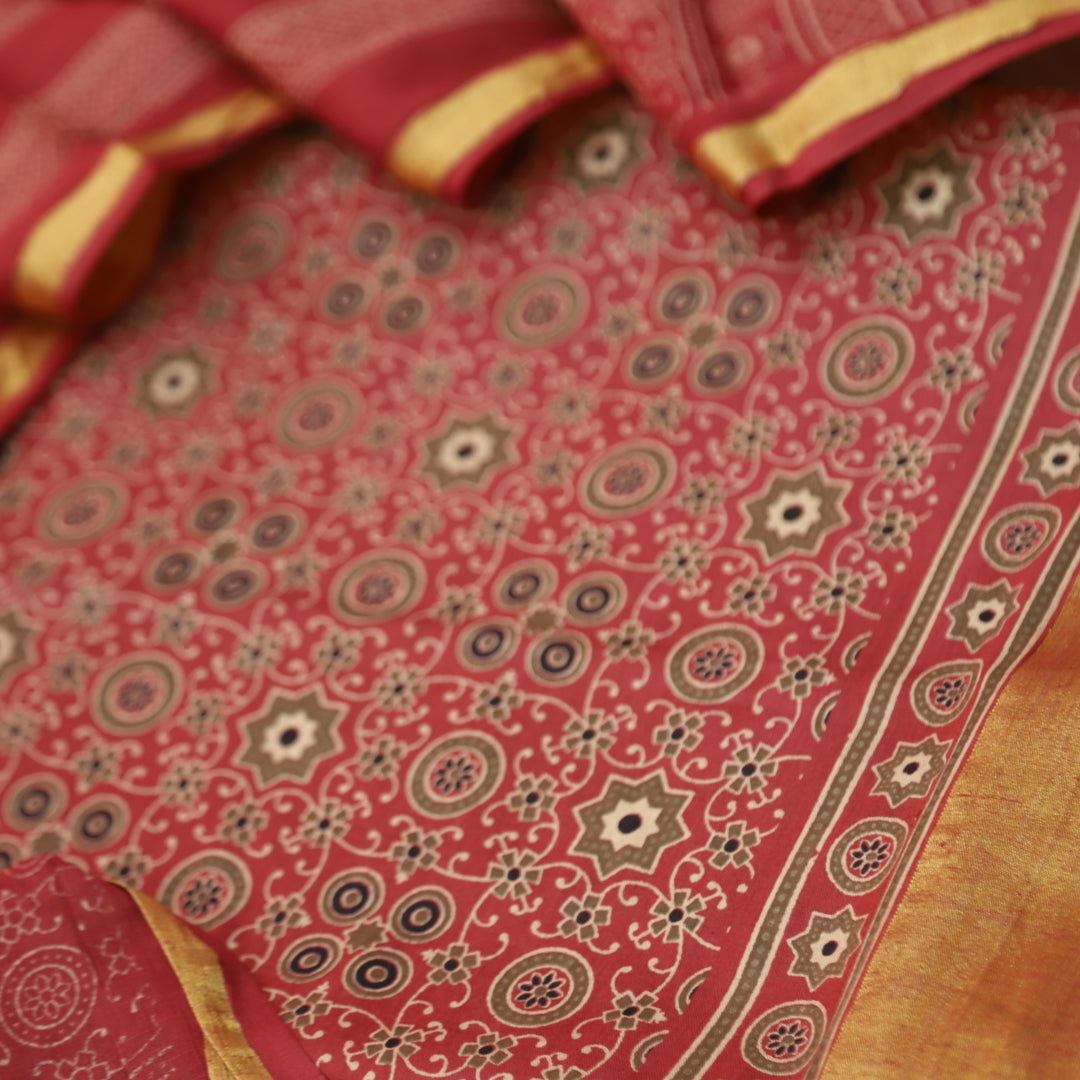 Kranti Berry Red Ajrak Printed Lagdi Patta Hem Work Cotton Suit Set