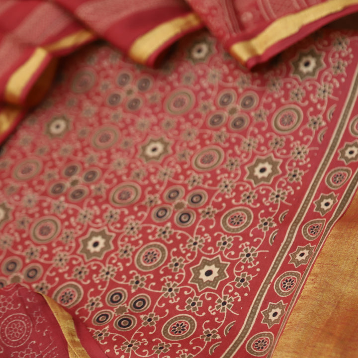 Kranti Berry Red Ajrak Printed Lagdi Patta Hem Work Cotton Suit Set