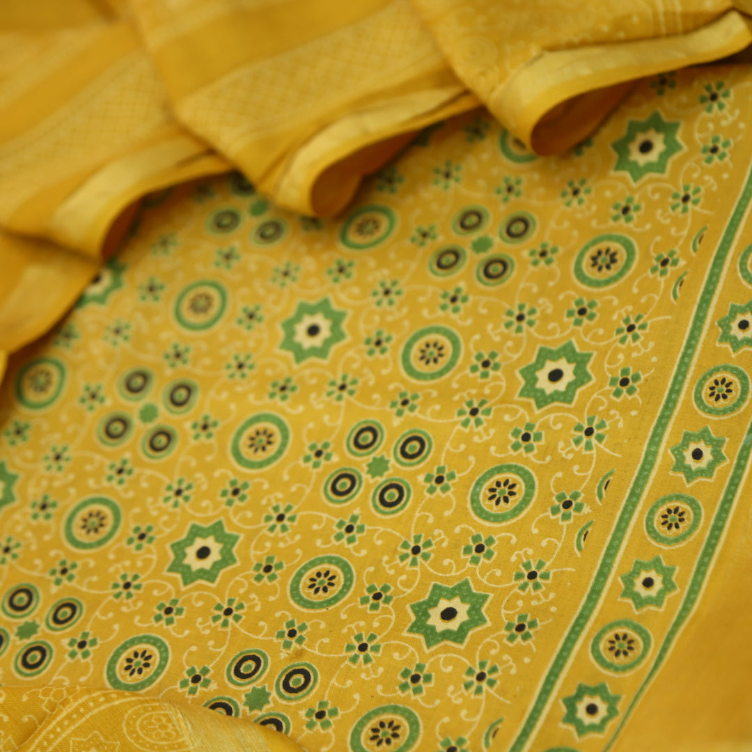 Kranti Canary Yellow Ajrak Printed Lagdi Patta Hem Work Cotton Suit Set