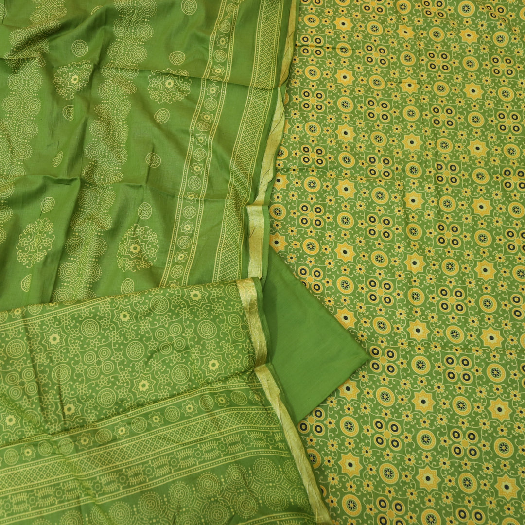 Kranti Grass Green Ajrak Printed Lagdi Patta Hem Work Cotton Suit Set