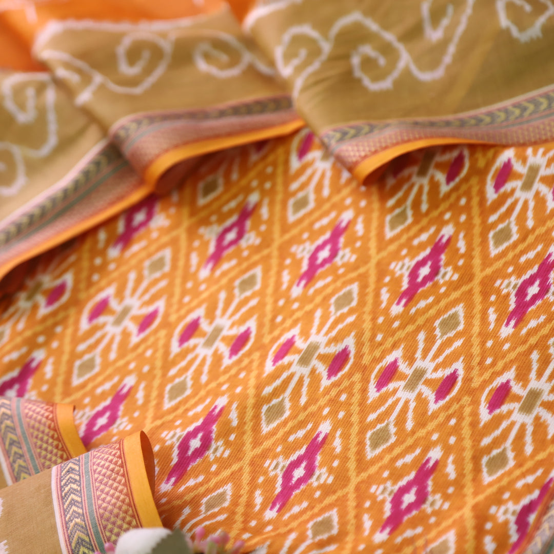 Kaasvi Orange Yellow Ikkat Printed Mangalgiri Hem Work Cotton Suit Set