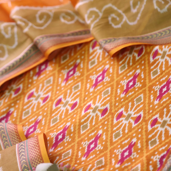 Kaasvi Orange Yellow Ikkat Printed Mangalgiri Hem Work Cotton Suit Set