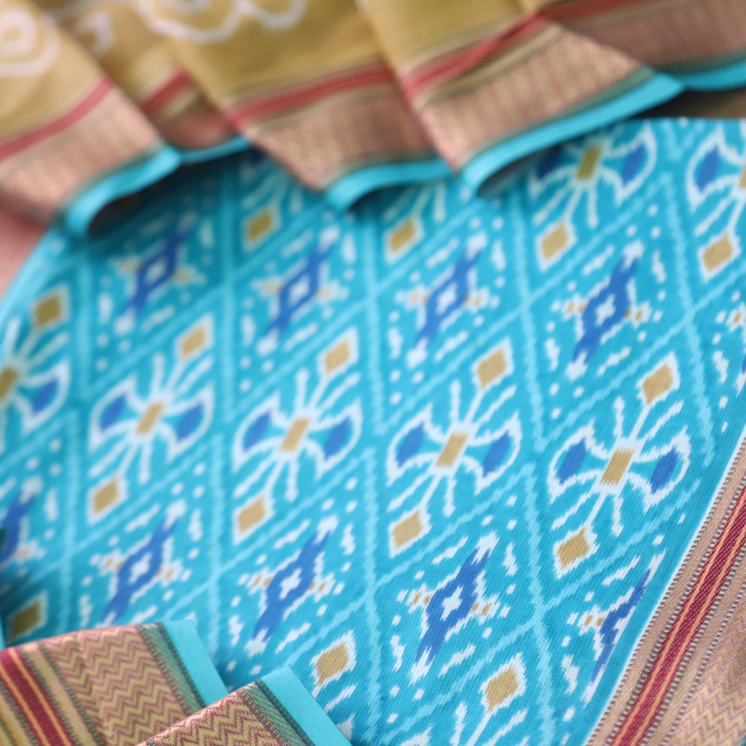 Kaasvi Aqua Blue Ikkat Printed Mangalgiri Hem Work Cotton Suit Set