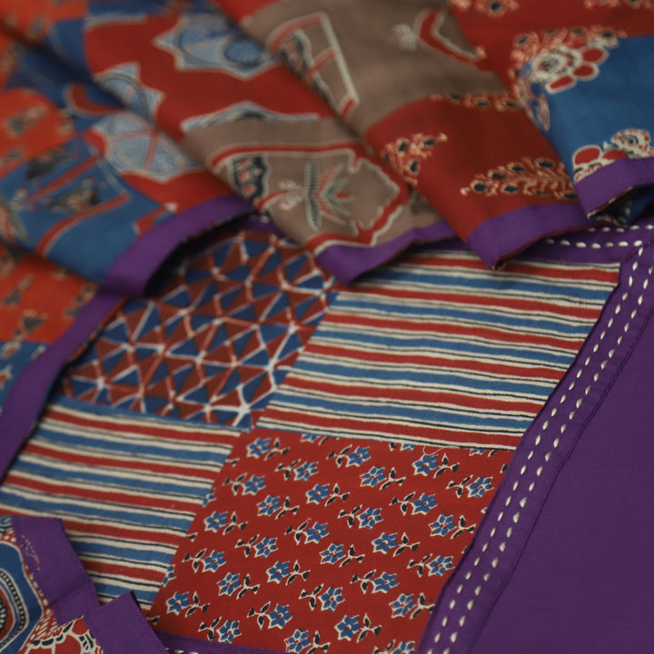 Aafeemi Orchid Purple Ajrak Patches Neck Work Cotton Suit Set