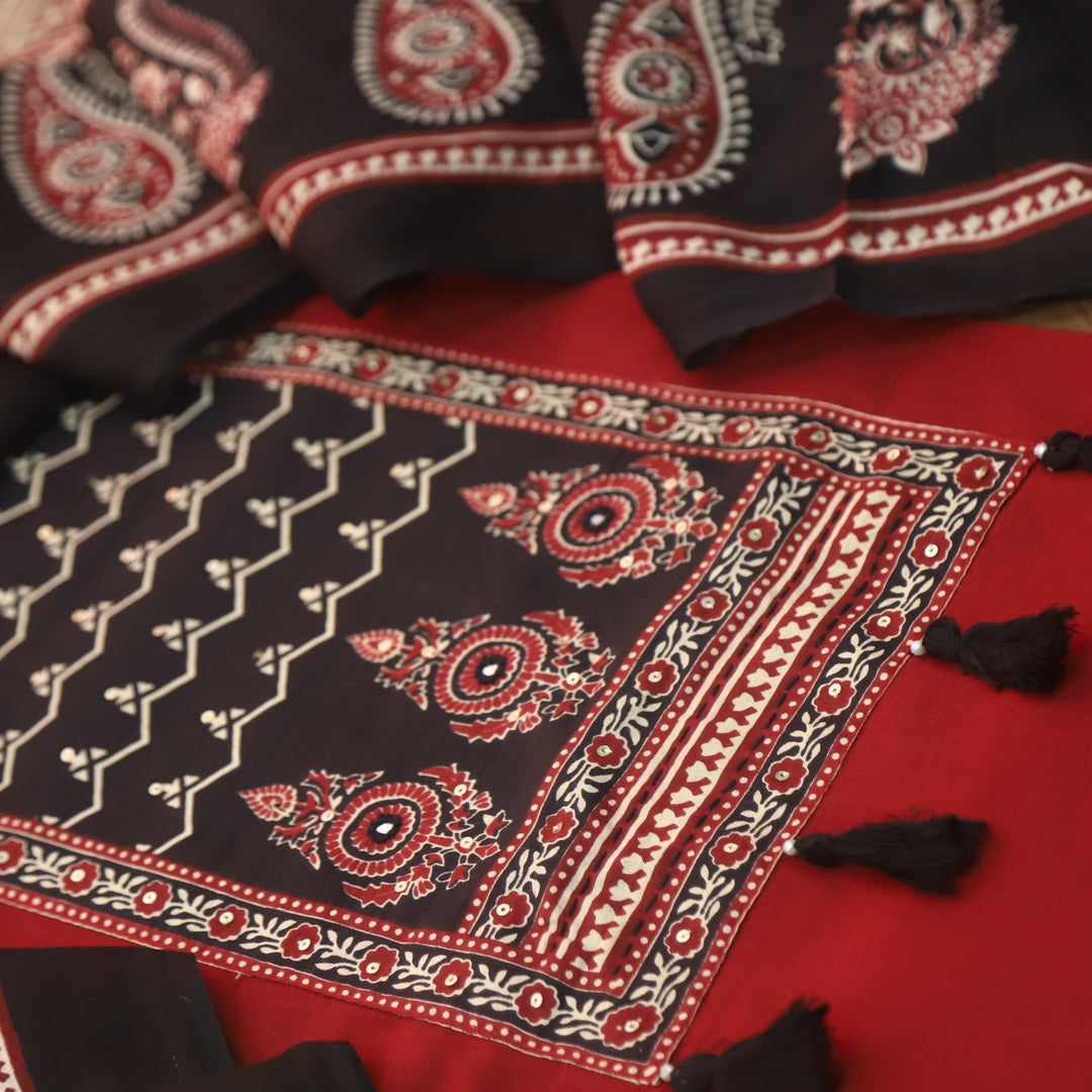 Lavanya Cherry Red Ajrak Printed Patch with Tessels hanging Cotton Suit Set