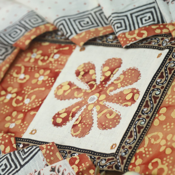 Sadhgi Tangerine Orange Applique Patch Neck Work in Batik Printed Cotton Suit Set