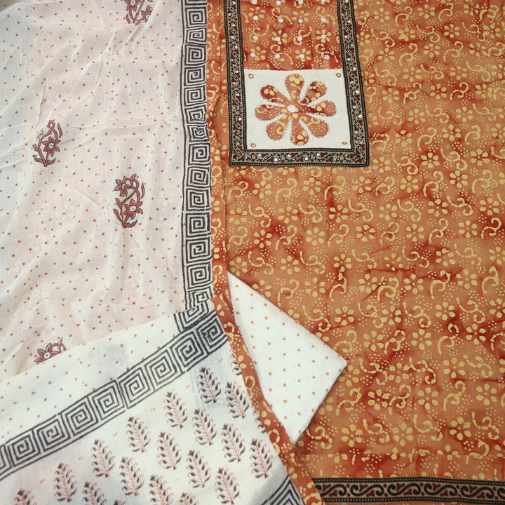 Sadhgi Tangerine Orange Applique Patch Neck Work in Batik Printed Cotton Suit Set