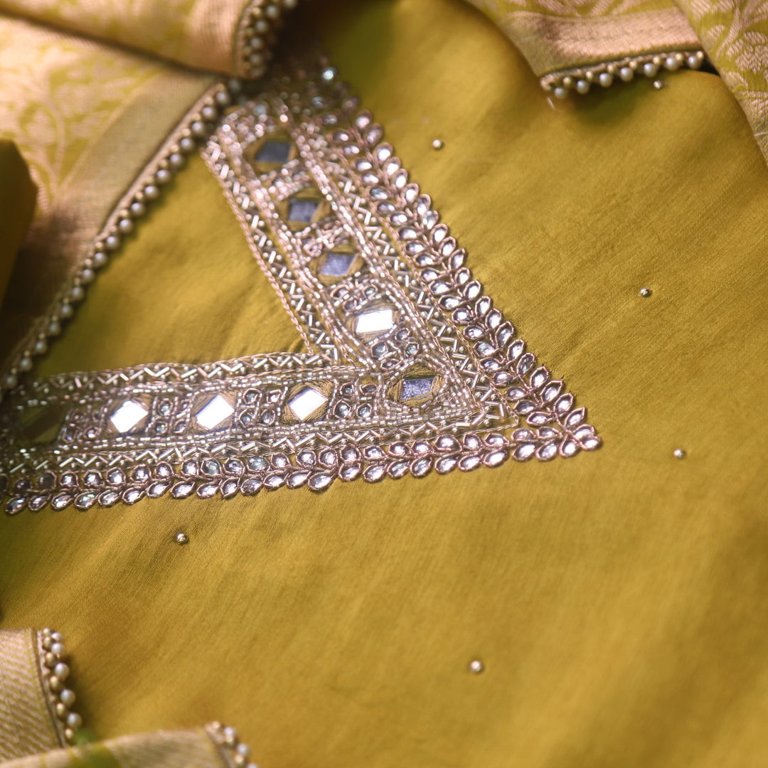 Naari Olive Green Embellished V Neck with Stone and Mirror Work Dola Silk Suit Set