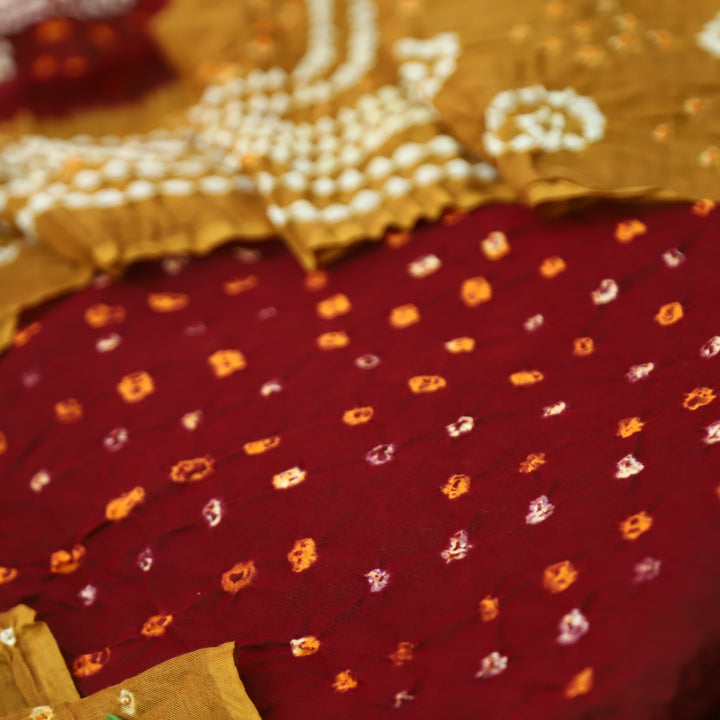 Sohini Dark Maroon All Over Authentic Bandhej Work Cotton Suit Set