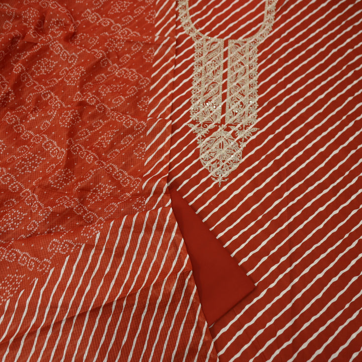 Dulhan Rust Orange All Over Leheriya Print with Embellish Neck Work Cotton Suit Set
