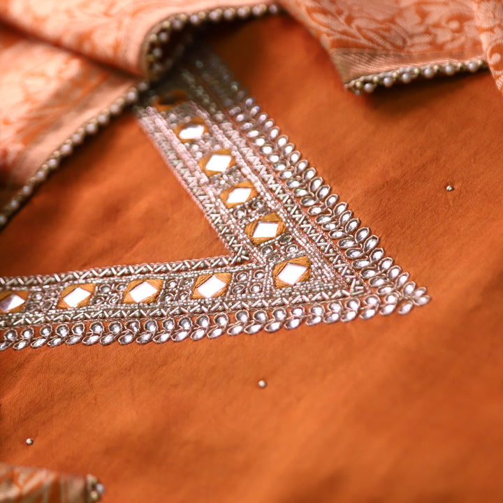 Naari Rust Orange Embellished V Neck with Stone and Mirror Work Dola Silk Suit Set