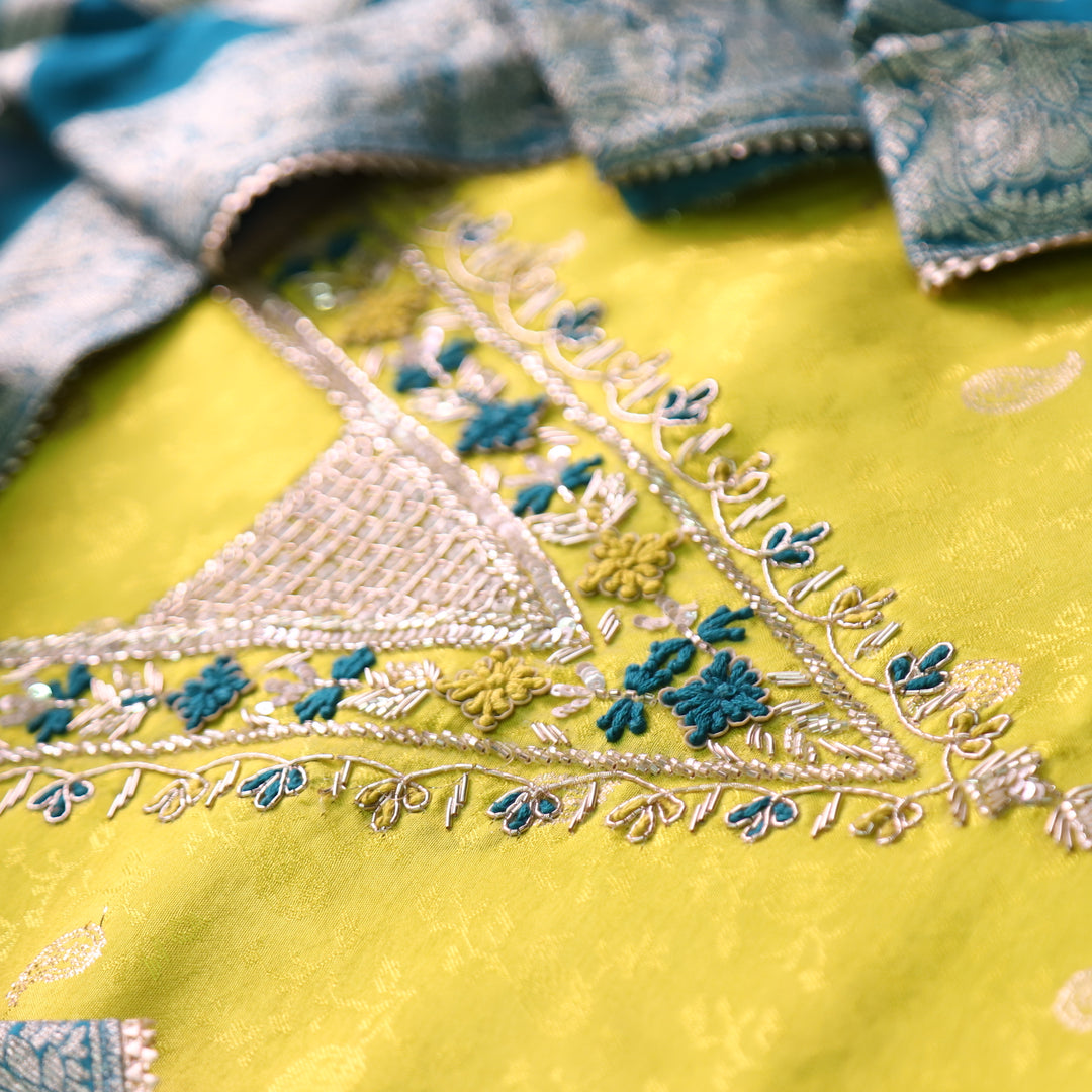 Naari Lemon Yellow V Neck Embellished Neckine in Brocade Work Dola Silk Suit Set