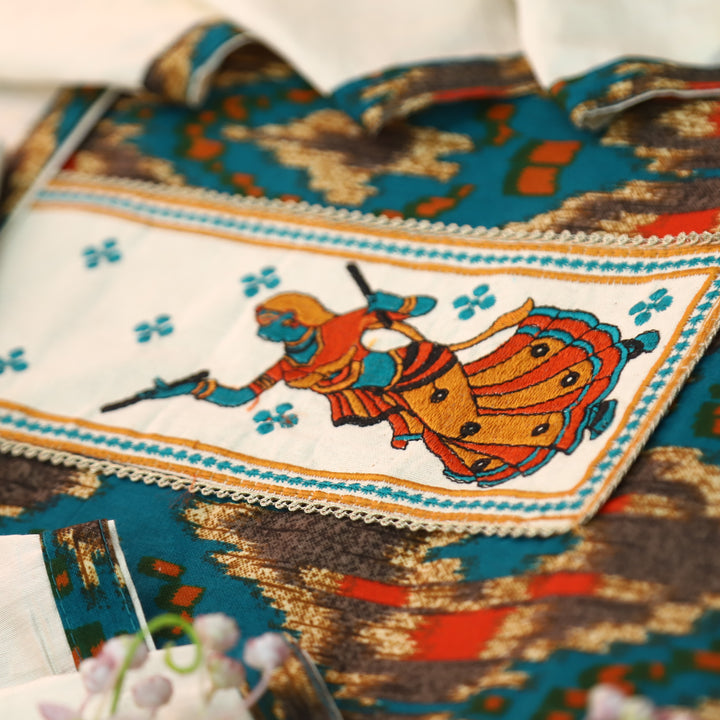 Mayaroop Cerulean Teal Embriodered Patch on Neck in Ikkat Printed Cotton Suit Set