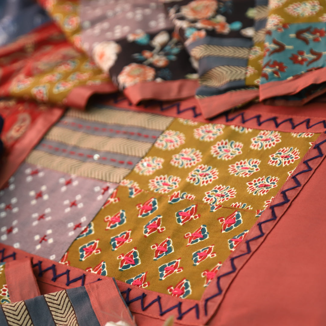 Aafeemi Mauve Pink Ajrak Patches Work Yoke Neck Glazed Cotton Suit Set