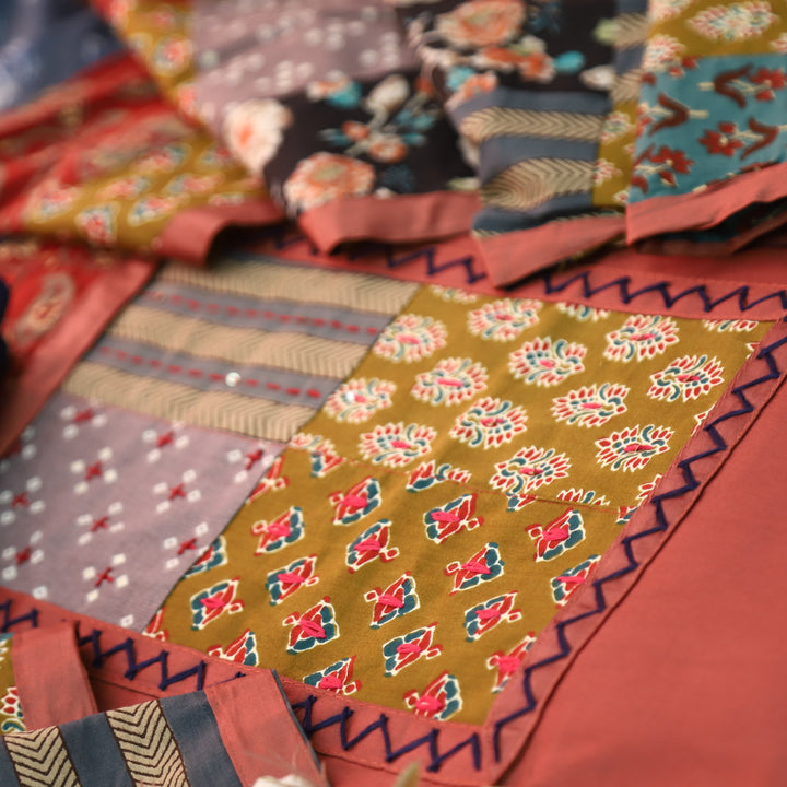 Aafeemi Mauve Pink Ajrak Patches Work Yoke Neck Glazed Cotton Suit Set
