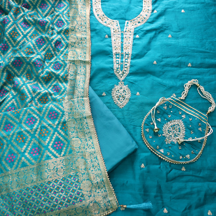 Sohini Cerulean Blue Embellished Neckline Work Chanderi Suit Set with Potli Bag