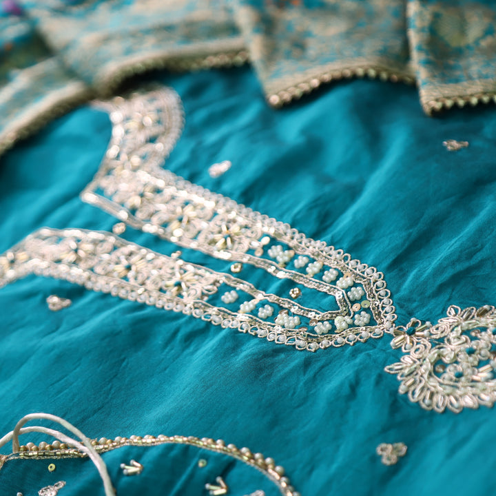 Sohini Cerulean Blue Embellished Neckline Work Chanderi Suit Set with Potli Bag