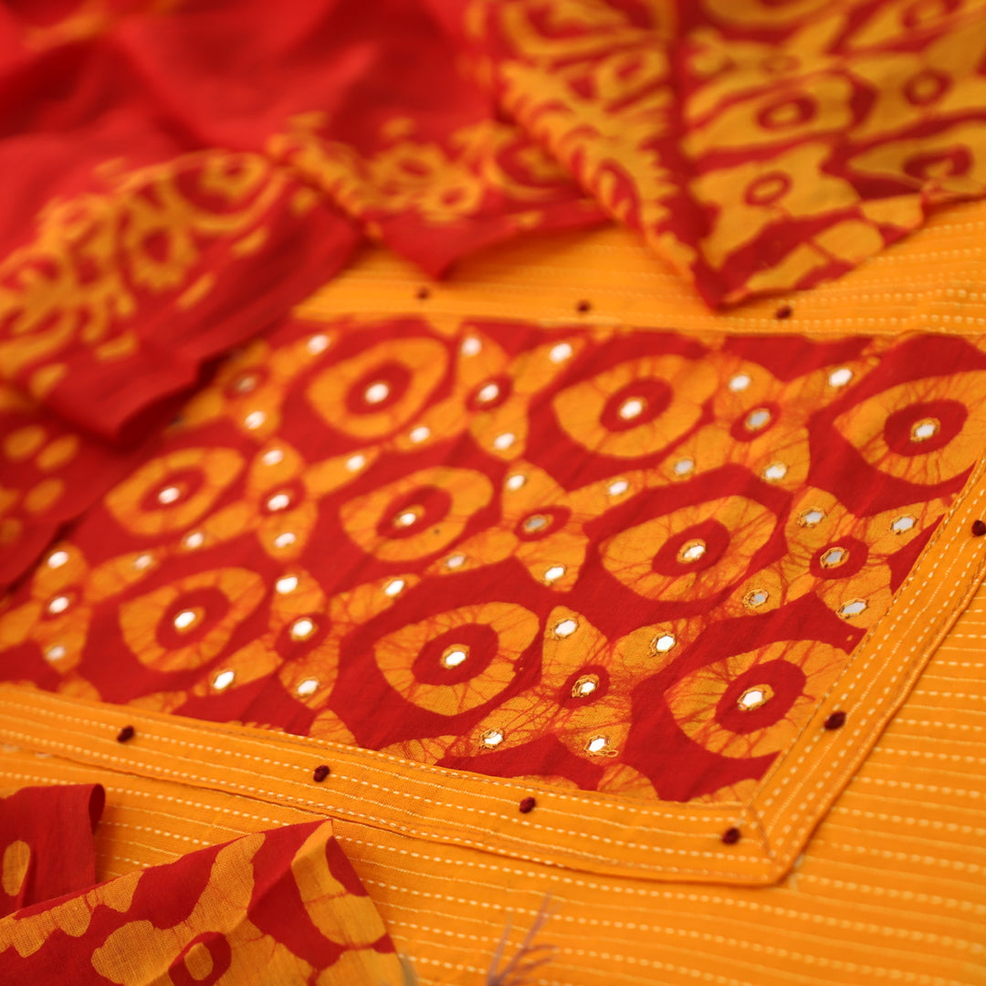Sanskriti Tangerine Orange Batik Print with Patra Work Rinning Stitch Cotton Suit Set-D1