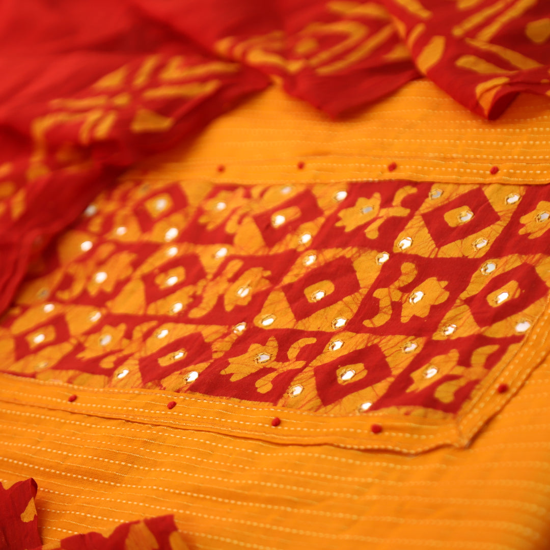 Sanskriti Tangerine Orange Batik Print with Patra Work Rinning Stitch Cotton Suit Set-D2