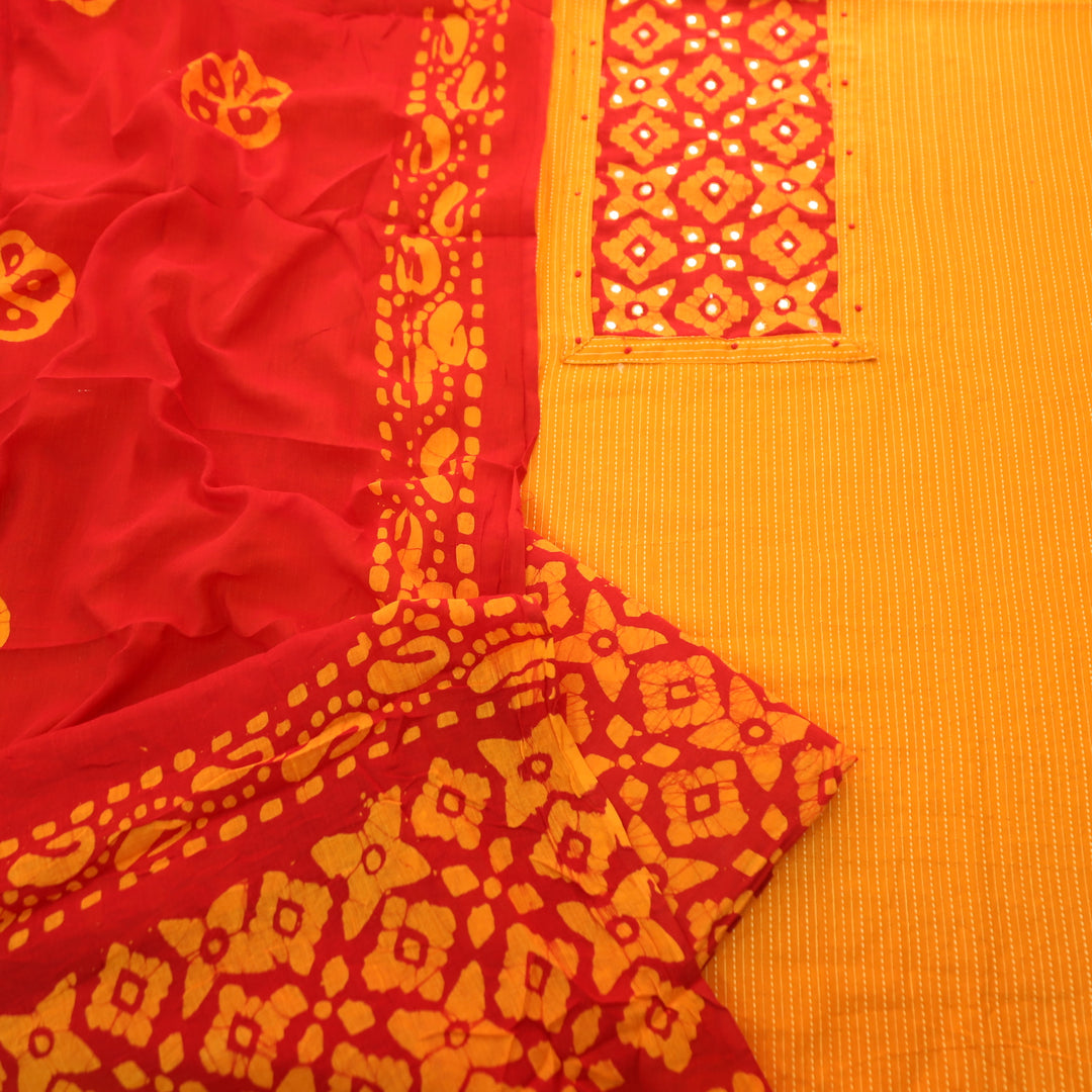 Sanskriti Tangerine Orange Batik Print with Patra Work Rinning Stitch Cotton Suit Set-D3