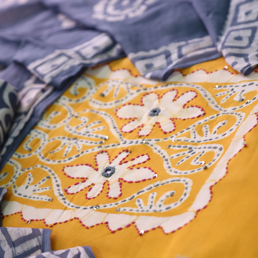 Zeenat Turmeric Yellow Kantha and Mirror Work in Batik Printed Cotton Suit Set