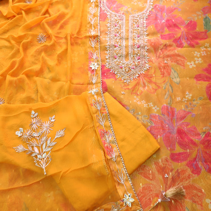 Sakhi Tangerine Yellow with Embellish Neck Work in Floral Printed Organza Suit Set