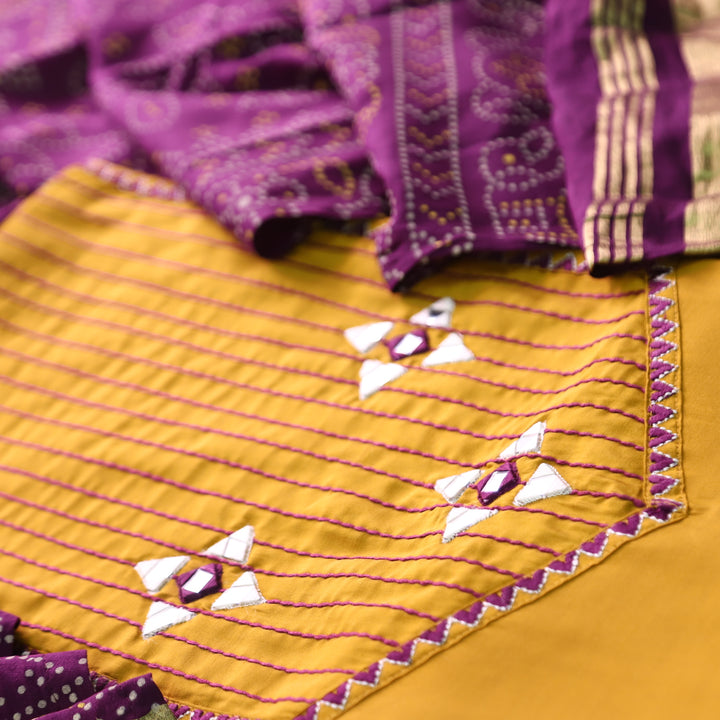 Saheli Turmeric Yellow Thread Embroidered Neck with Mirror Work Roman Silk Set