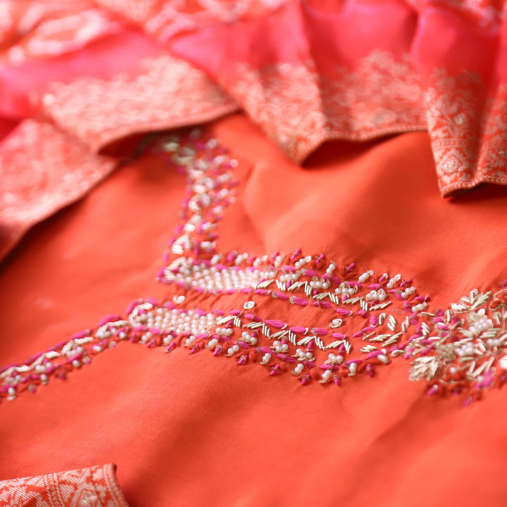 Shreya Tangerine Orange Embellished Kardana Work Neck in Dola Silk Set