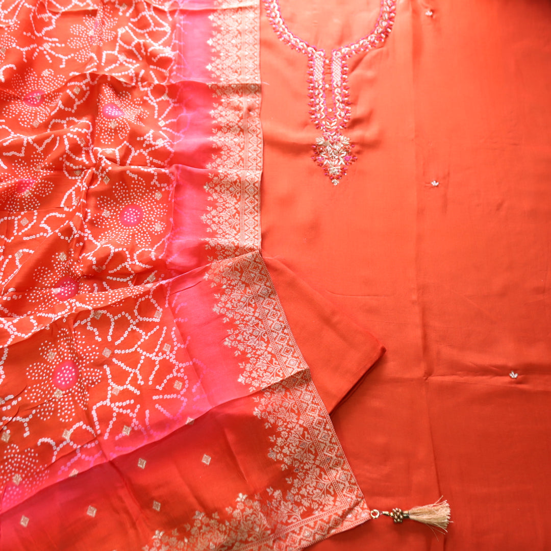 Shreya Tangerine Orange Embellished Kardana Work Neck in Dola Silk Set
