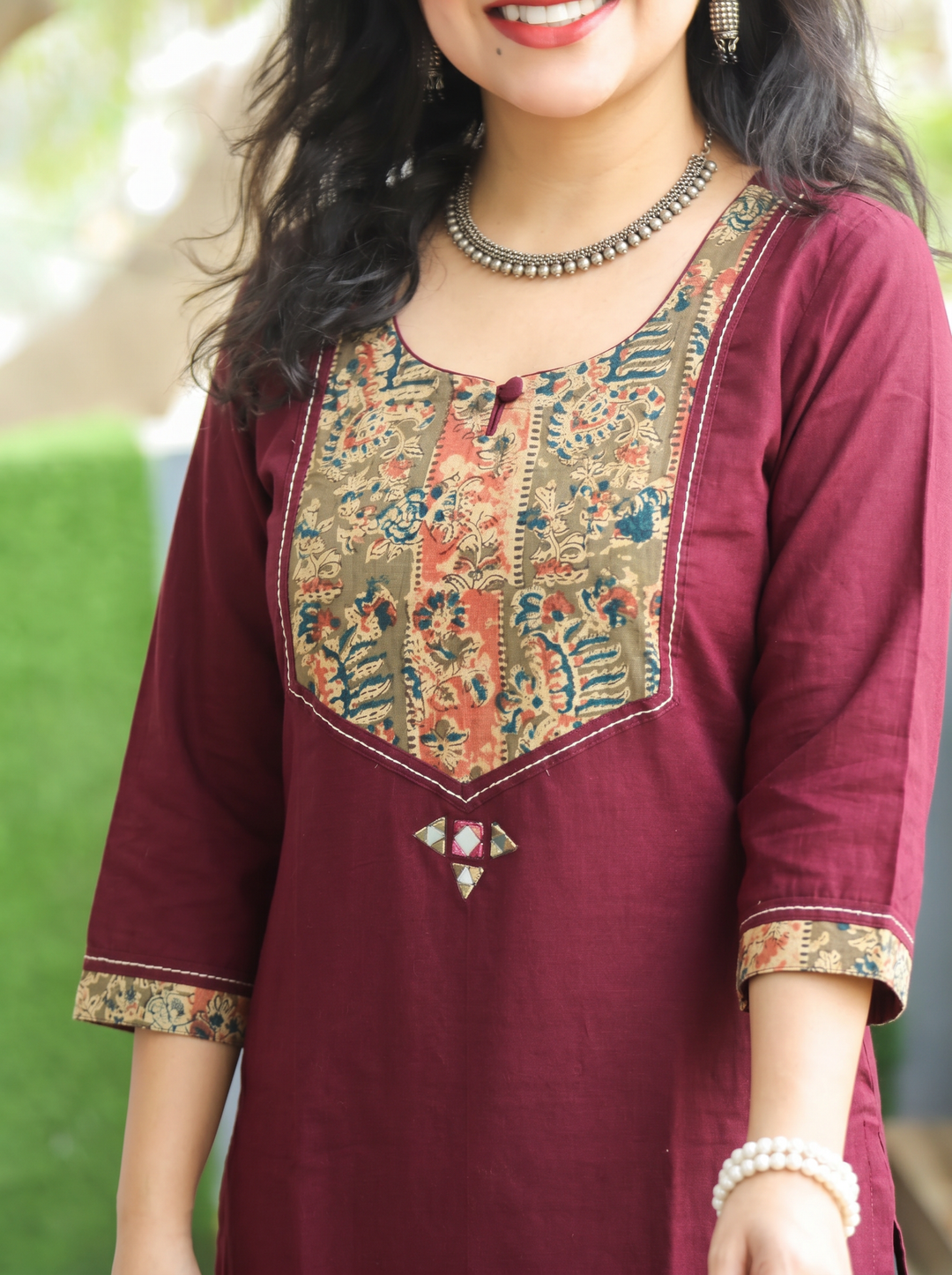 Kanak Wine Purple Kalamkari Printed Yoke Cotton Kurti