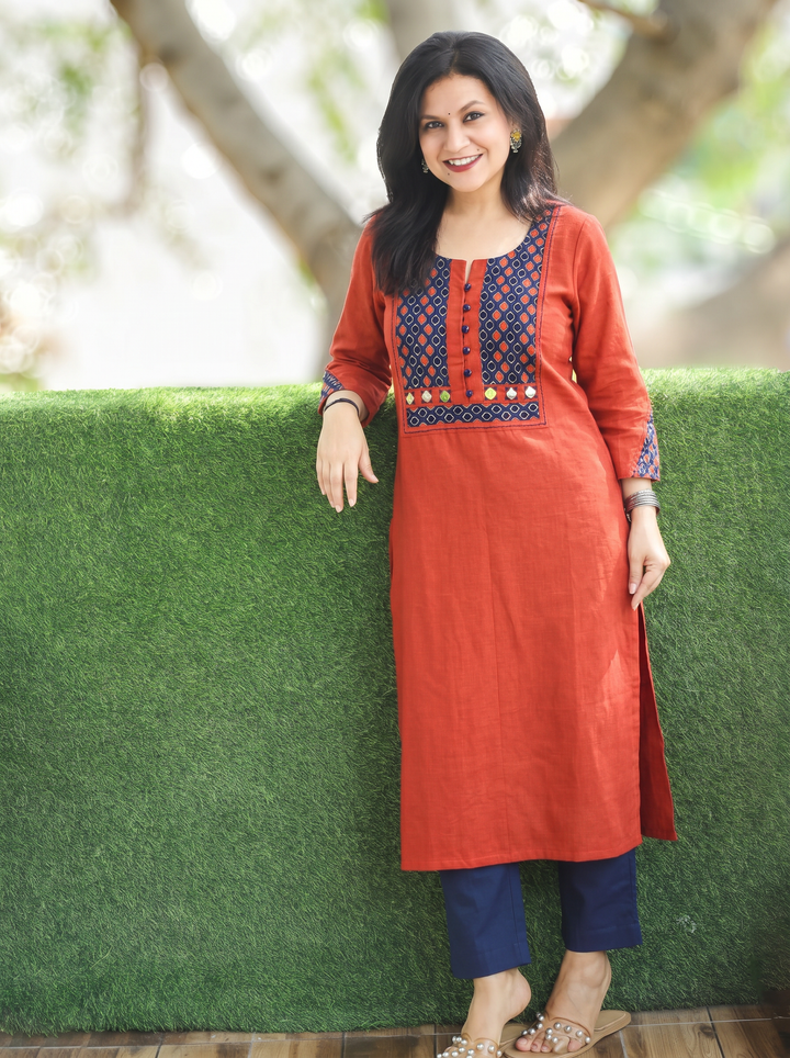 Sridevi Rust Orange Potli with Mirror Ajrak Yoke Cotton Kurti