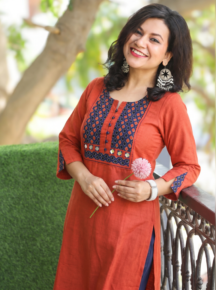 Sridevi Rust Orange Potli with Mirror Ajrak Yoke Cotton Kurti