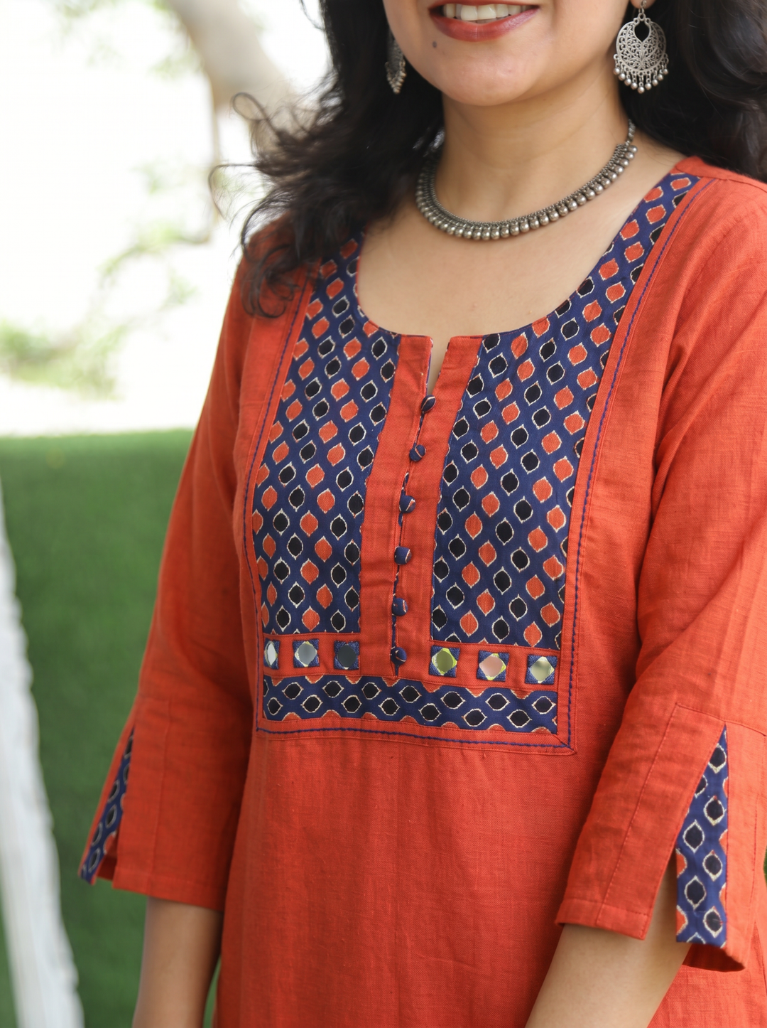 Sridevi Rust Orange Potli with Mirror Ajrak Yoke Cotton Kurti