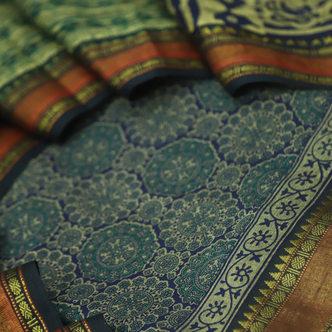 हीरल Dark Blue Ajrak Printed Mangalgiri Hem Work Cotton Suit Set