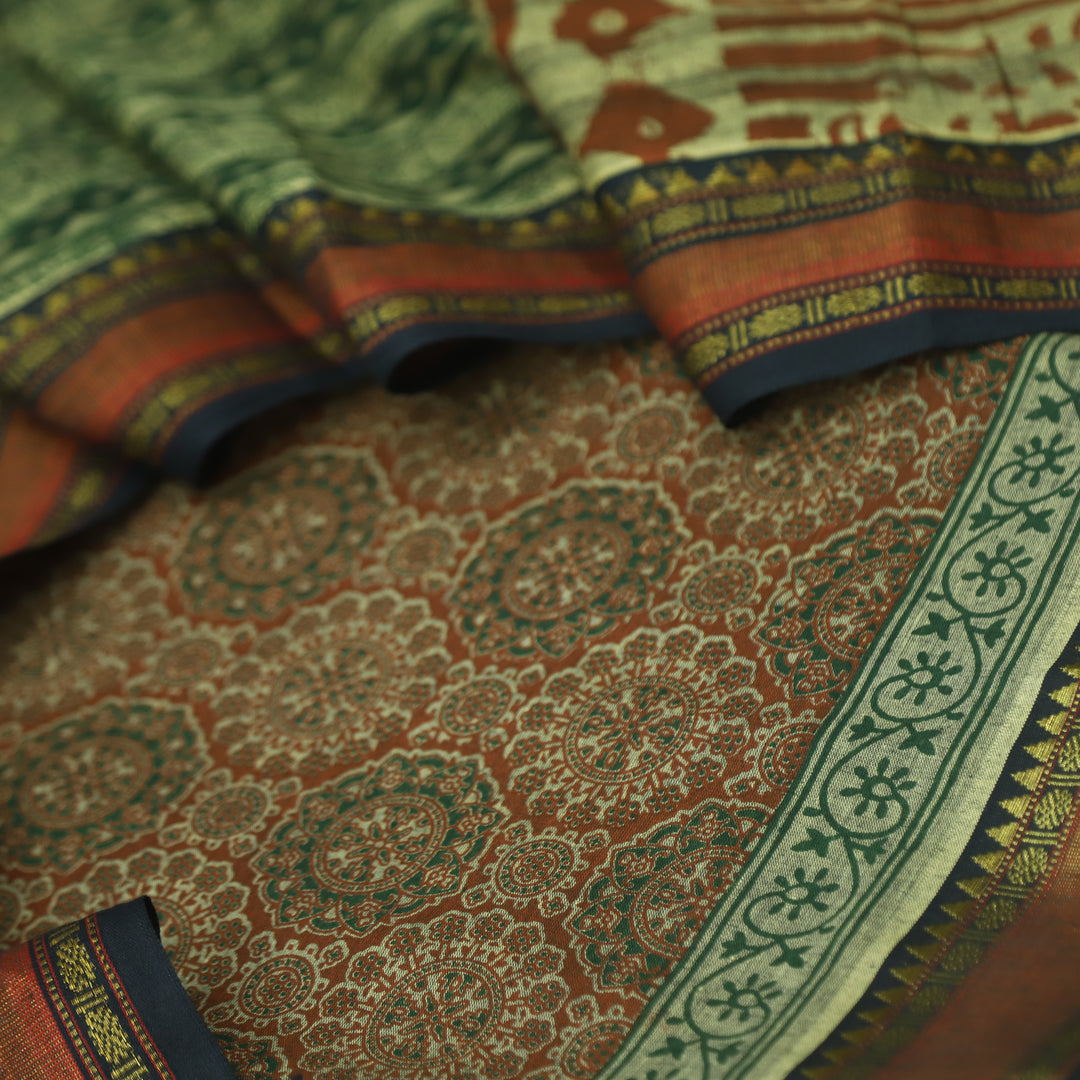 हीरल Rust Orange Ajrak Printed Mangalgiri Hem Work Cotton Suit Set