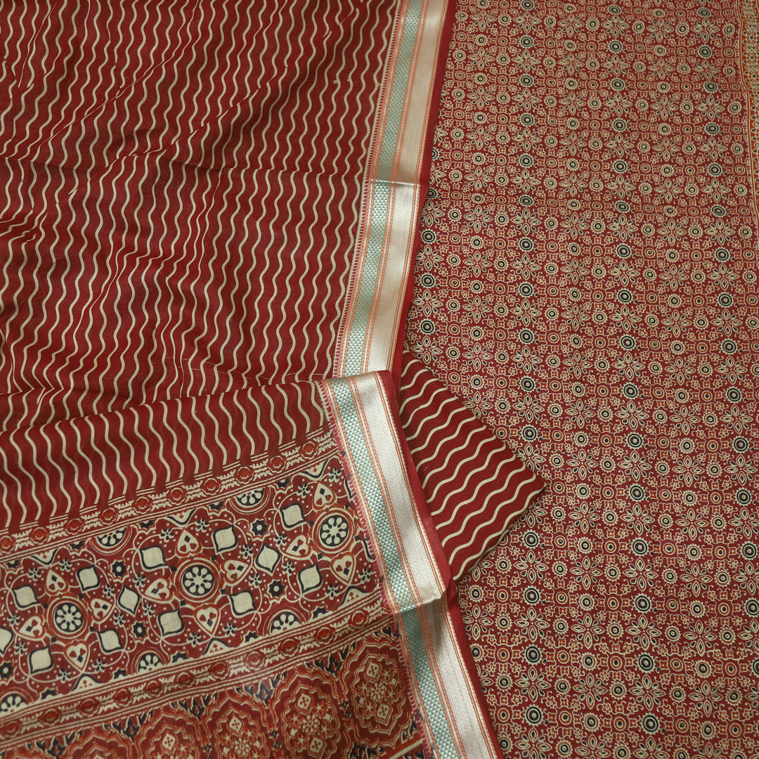 दिपशा Cheery Red Ajrak Printed Mangalgiri Hem Work Cotton Suit Set