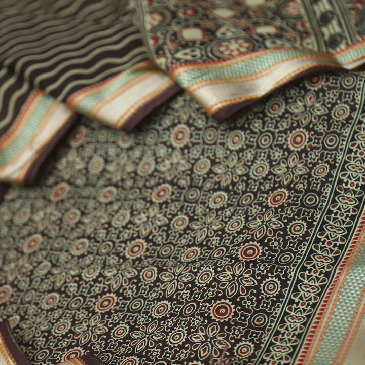 दिपशा Choco Brown Ajrak Printed Mangalgiri Hem Work Cotton Suit Set